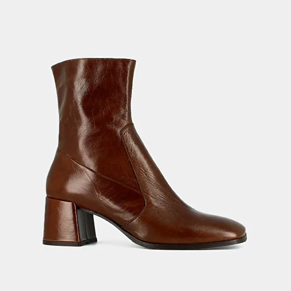 Oval-toe boots in brown aged leather