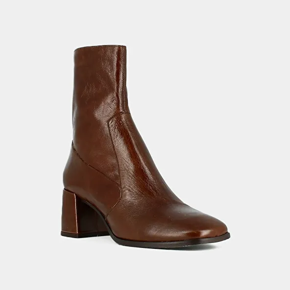 Oval-toe boots in brown aged leather